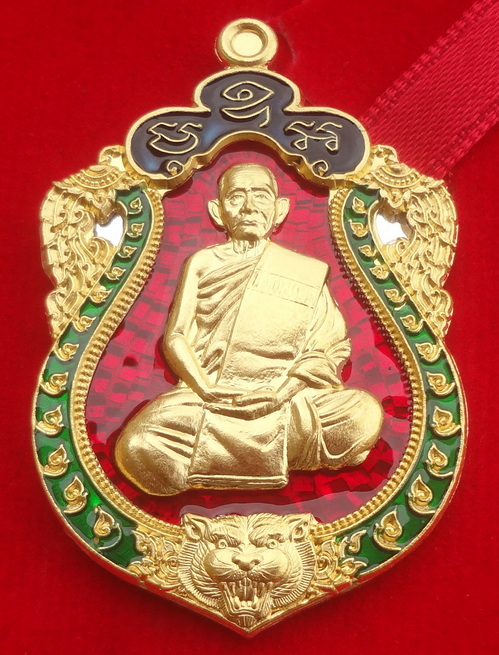 เหรียญเสมาหัวเสือ รุ่นแรก หลวงปู่บุญมา วัดบ้านแก่ง (สำนักสงฆ์เขาแก้วทอง) จ.ปราจีนบุรี วันที่ 30 สิงหาคม พ.ศ.2561 เนื้อเงิน หน้ากาก/ขอบทองคำ ลงยาพื้นสีแดง/บนสีน้ำเงิน/ขอบสีเขียว ตอกโค๊ตและหมายเลข ๙ ขนาดเหรียญรวมห่วงตัน 2.7 x 4.2 ซ.ม. จำนวนสร้าง 19 เหรียญ